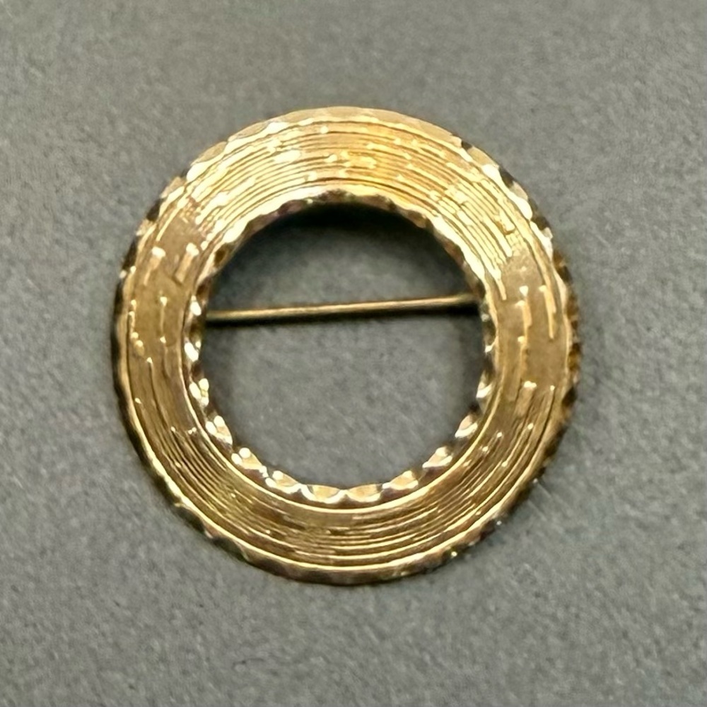 Elegant Gold-Tone Circular Brooch